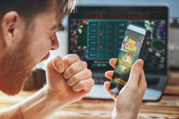 Filipino player accessing ph arcade sports and casino games on a mobile phone
